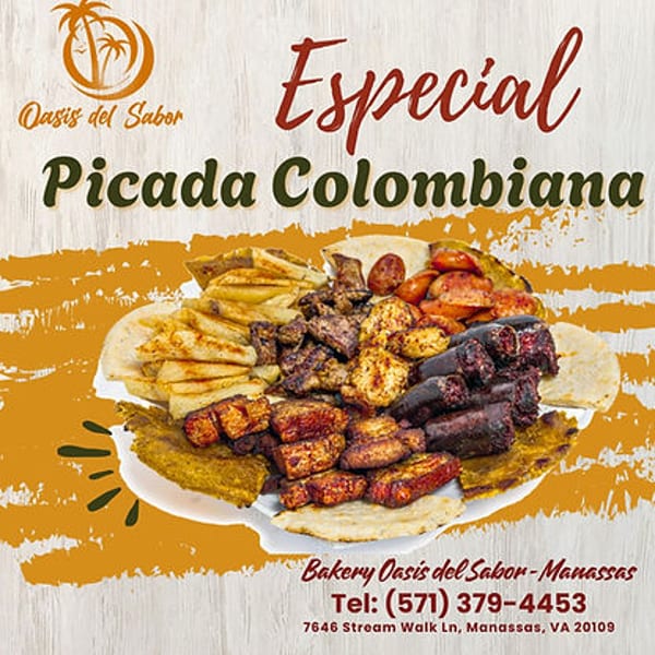 A large platter of Colombian Picada with various meats, plantains, and arepas.
